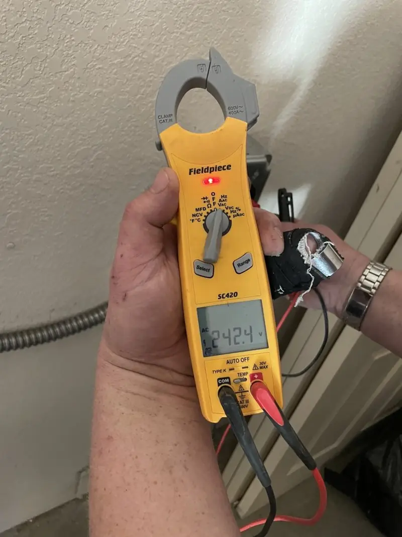 Voltage testing with clamp meter during Electrical Installation Services in Jonesboro